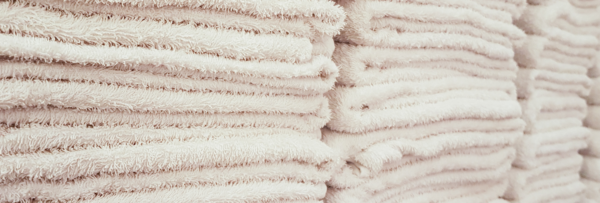 Towels Stacked On Shelves 1920X650